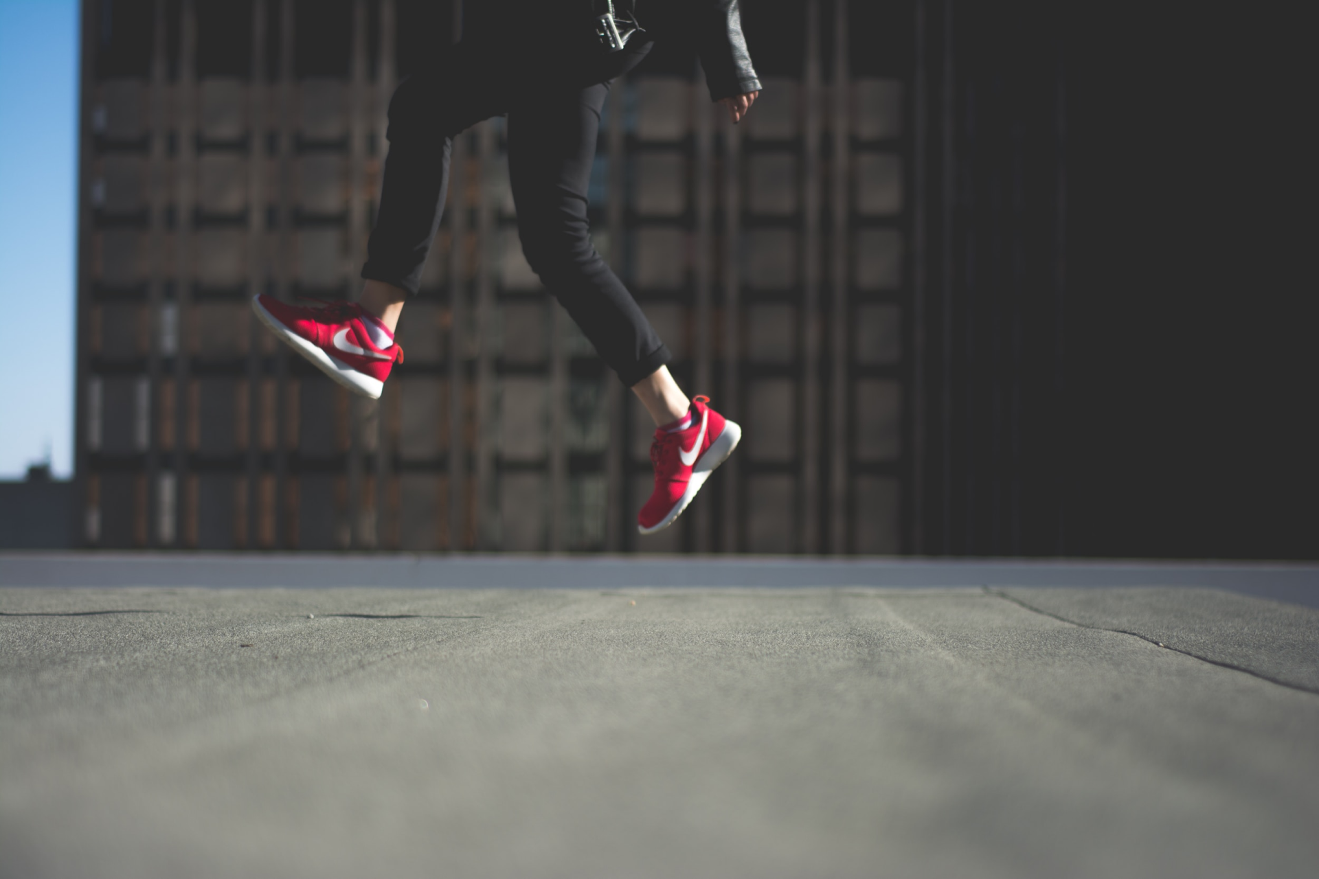 Image of a person's legs taking a leap showing how self-directed learning can improve performance